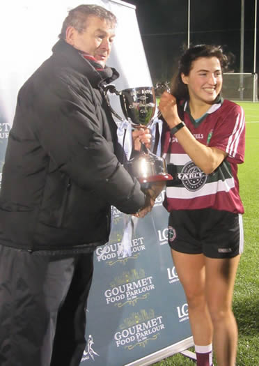 St Mary's ladies gaelic football team captain, Aine McAlister accepting the Gourmet Food Parlour Moynihan Cup