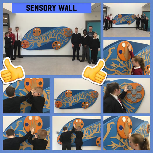 The school pupils testing the sensory wall to give feedback to Owen